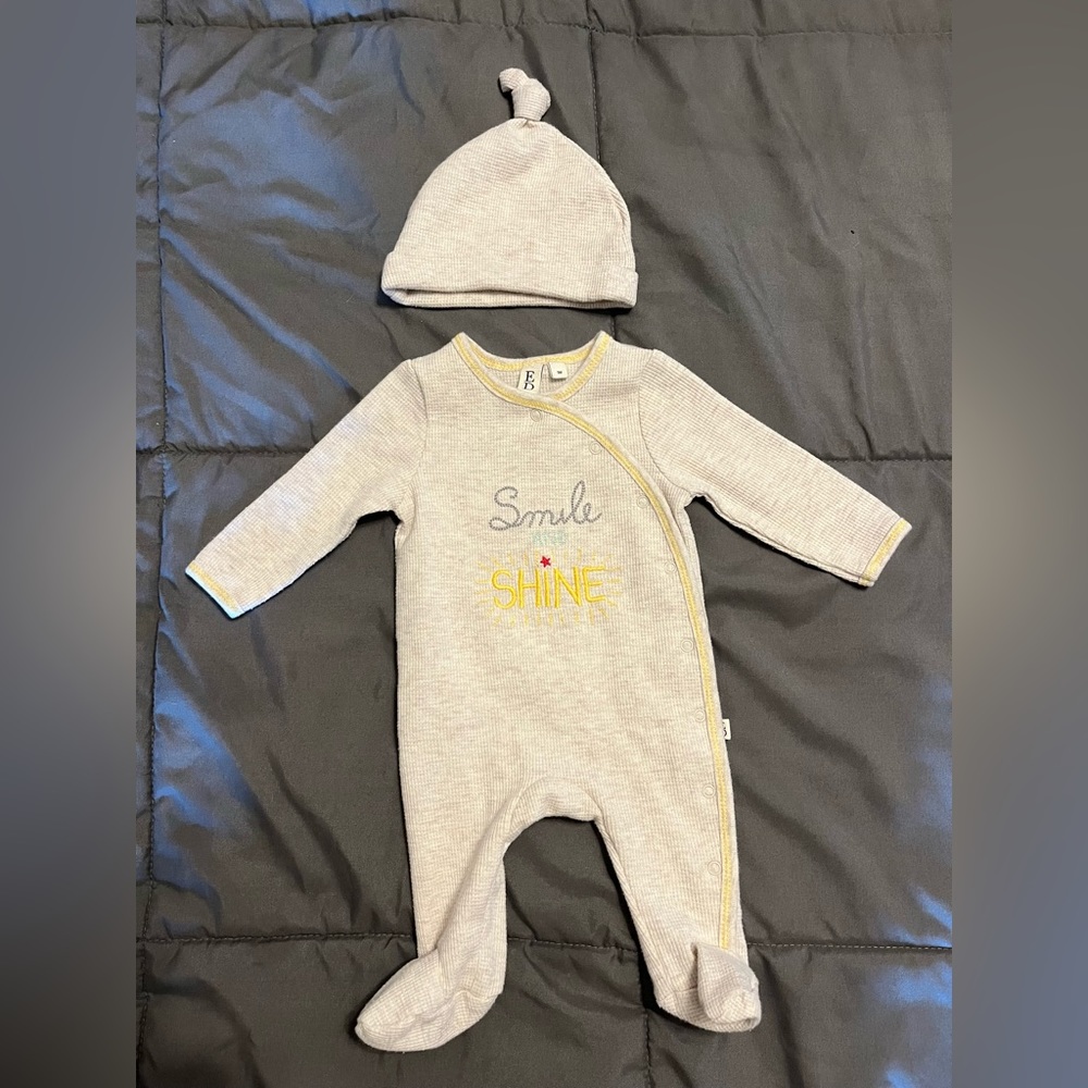 Baby onesie with matching hat.
